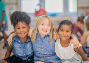 Three diverse friends at kindergarten